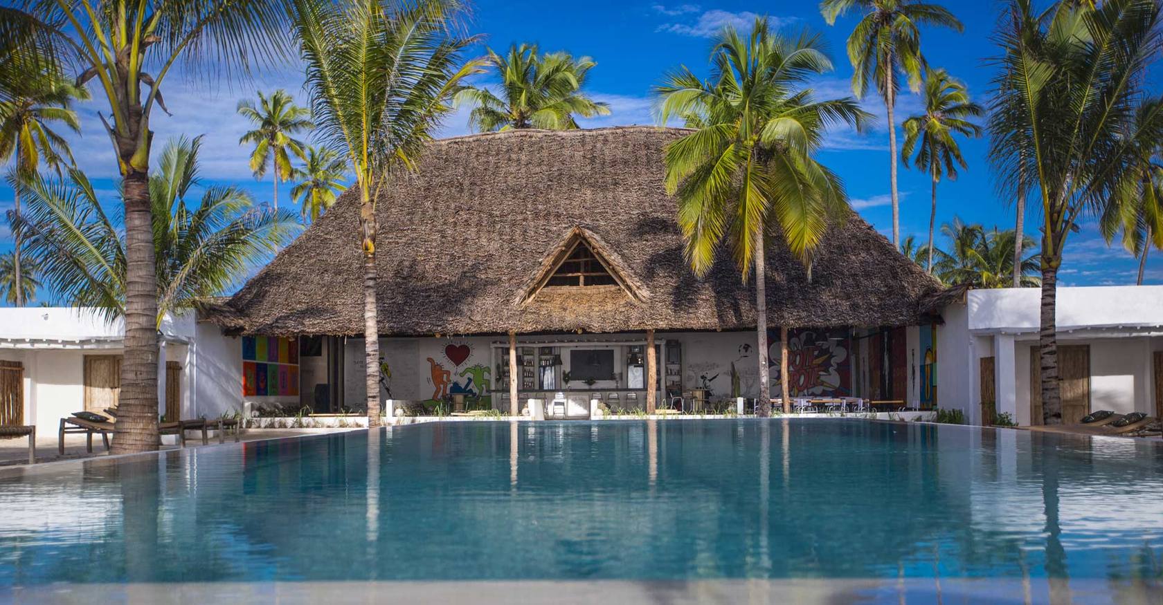 The Loop Beach Resort pool and thatched lodge by the lagoon in Jambiani, Zanzibar